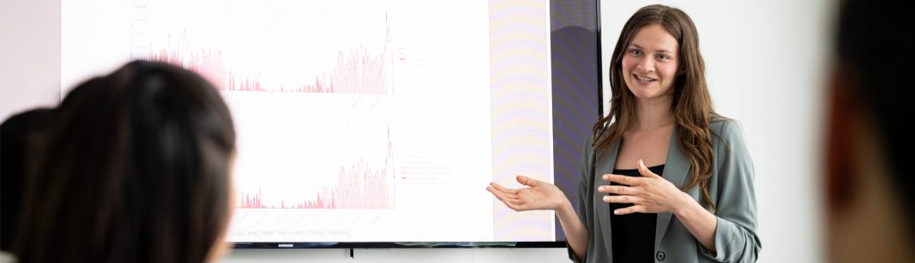 Prism staff presenting energy strategy graphs and strategies.