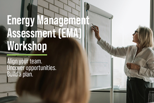 Professional woman writing on a white board during a business meeting.